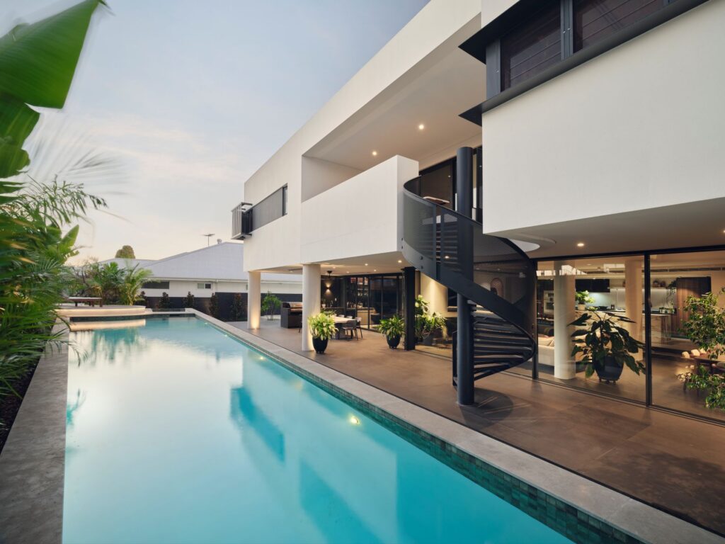 |Coolbinia Custom Home|Weststyle|Sculptural residential architecture|Sculptural staircase design|Marble kitchen design|Weststyle custom homes|Family-focused luxury home|Coolbinia custom home|Luxury home builder Perth|Ensuite bedrooms family home|Skylit bedroom design|Luxury master suite design|Warm contemporary interiors|Curved architecture design|Resort-style pool design|