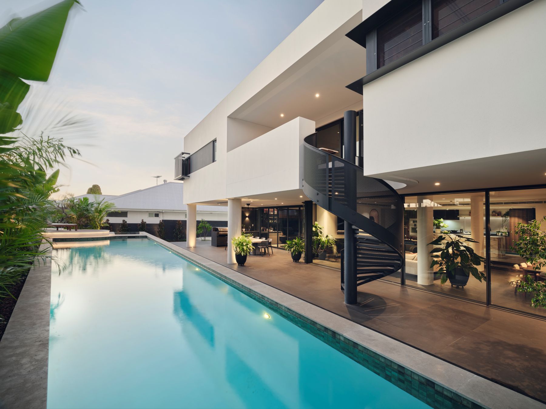 |Coolbinia Custom Home|Weststyle|Sculptural residential architecture|Sculptural staircase design|Marble kitchen design|Weststyle custom homes|Family-focused luxury home|Coolbinia custom home|Luxury home builder Perth|Ensuite bedrooms family home|Skylit bedroom design|Luxury master suite design|Warm contemporary interiors|Curved architecture design|Resort-style pool design|